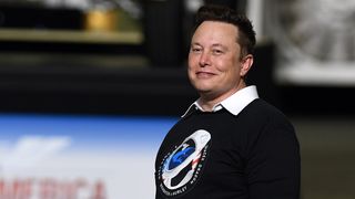 SpaceX founder Elon Musk looks on after being recognized by U.S. President Donald Trump at NASA's Vehicle Assembly Building